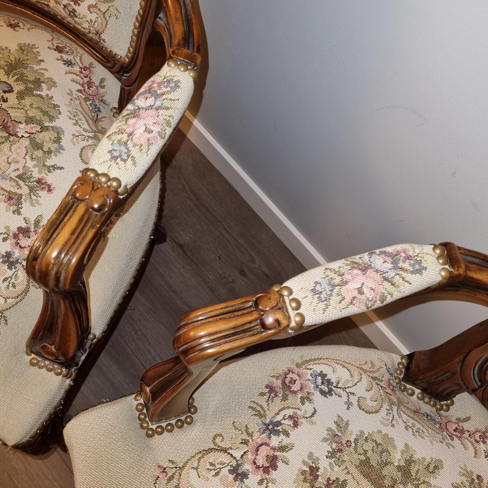 Detail of ornate needlepoint armrests on chairs from Louis XV–Style Dining Set | Extendable table with 4 Needlepoint Armchairs -Rococo dining set