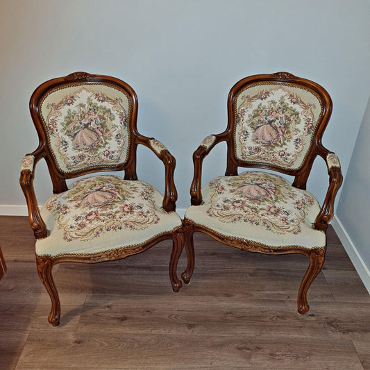 Pair of needlepoint armchairs with intricate floral and figurative upholstery in Louis XV–Style Dining Set | Extendable table with 4 Needlepoint Armchairs -Rococo dining set