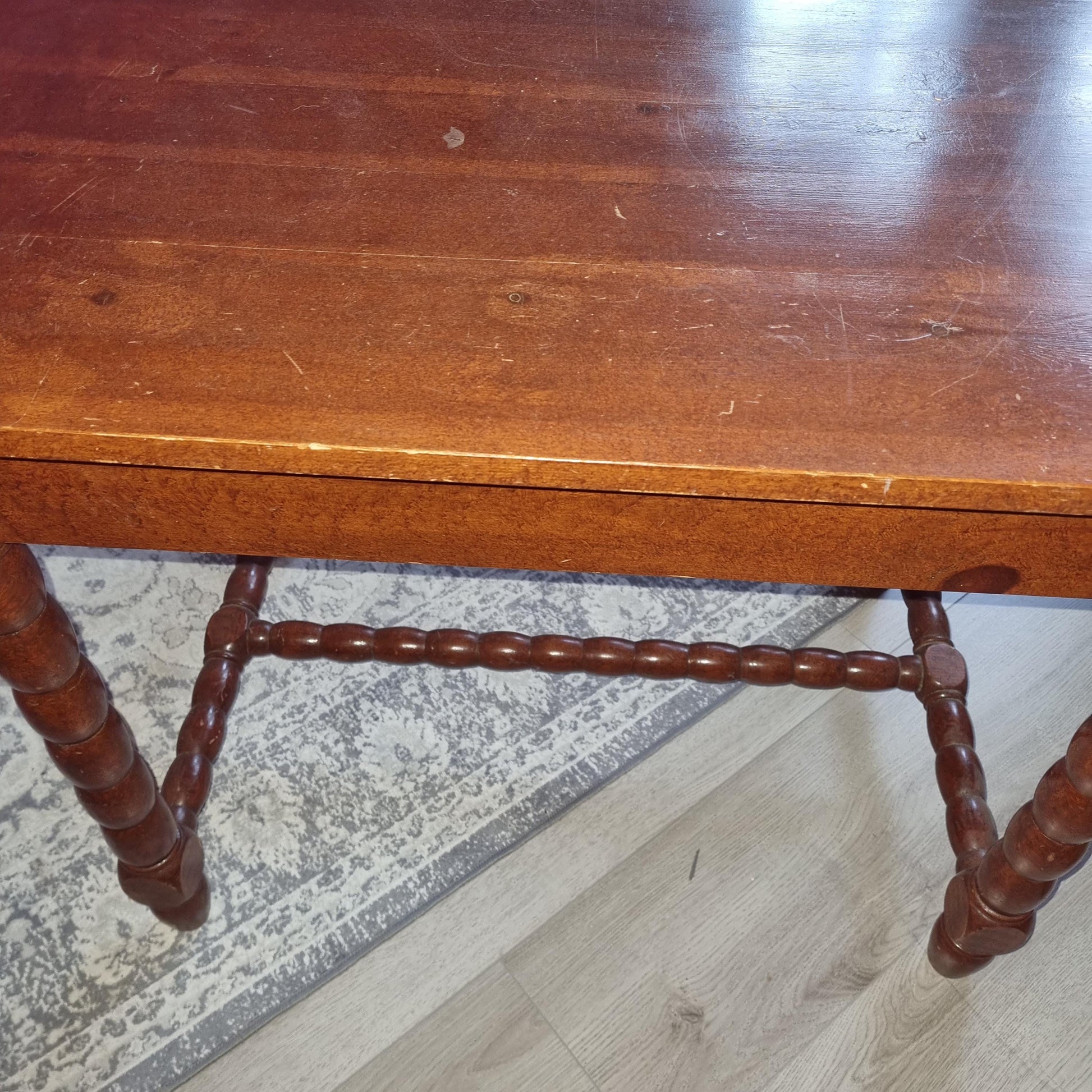 Antique Swedish Drop-Leaf Dining Set: Hand-Painted Kurbits Folk Art, Circa 1900 wooden table detail with turned legs