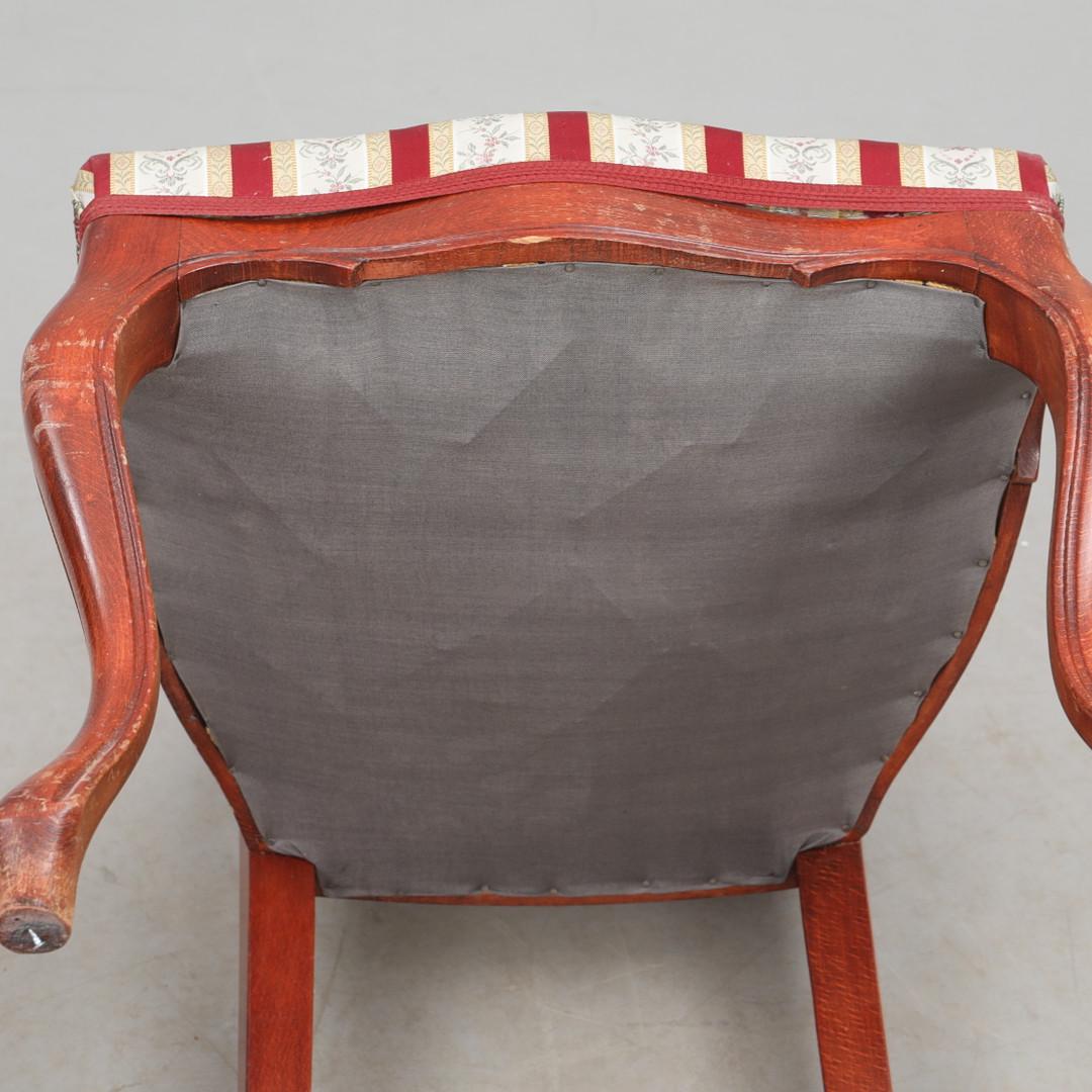 Antique Victorian Chair & Side Table Set showing underside of carved wood chair with striped upholstery