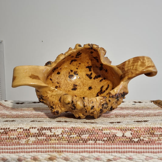Hand Carved Root Wood Bowl: Organic Wabi-Sabi Scandinavian Decor showing natural wood grain and textured edges on woven surface