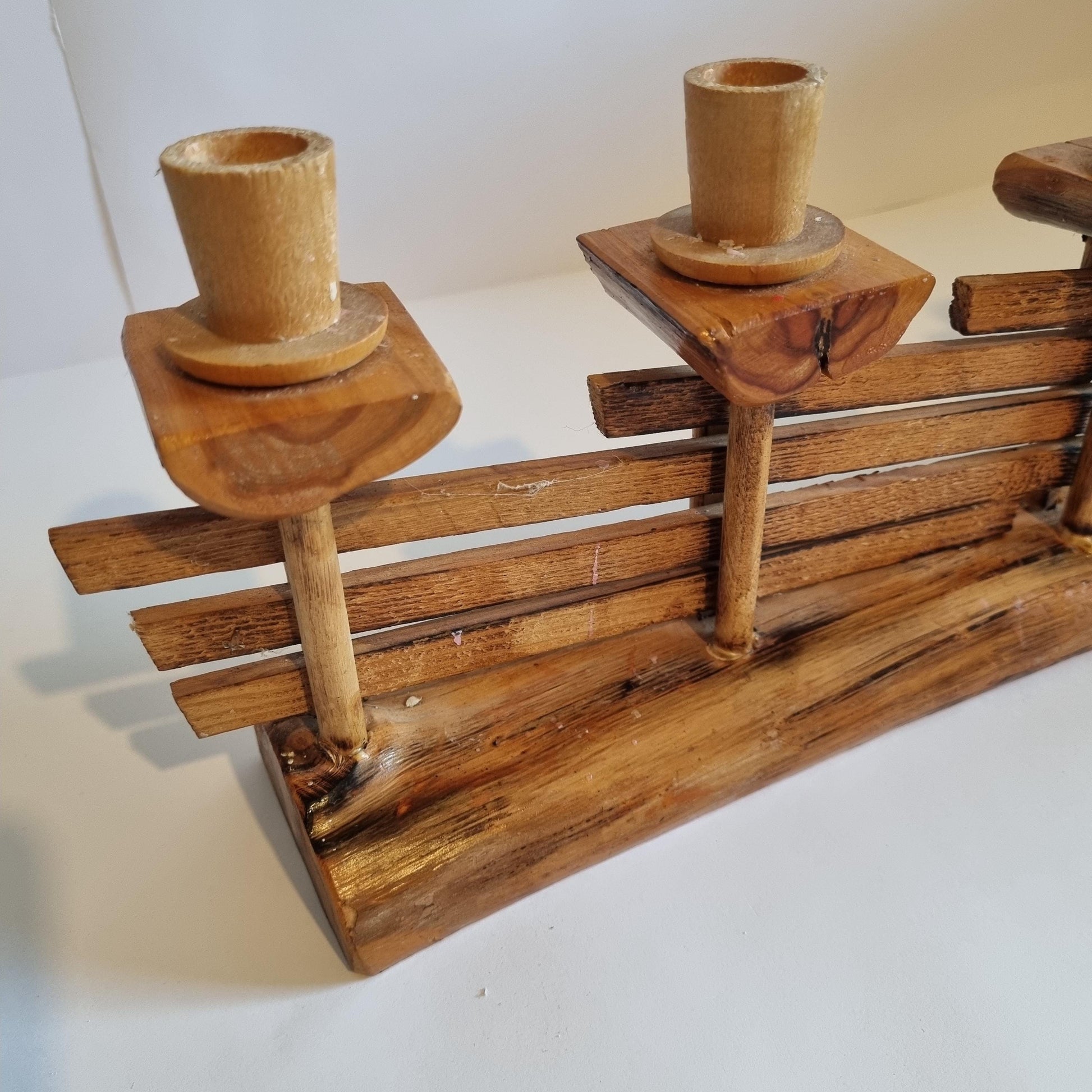Handmade Wooden Candle Holder: Rustic Scandinavian Fence Design with natural wood texture and three candle cups