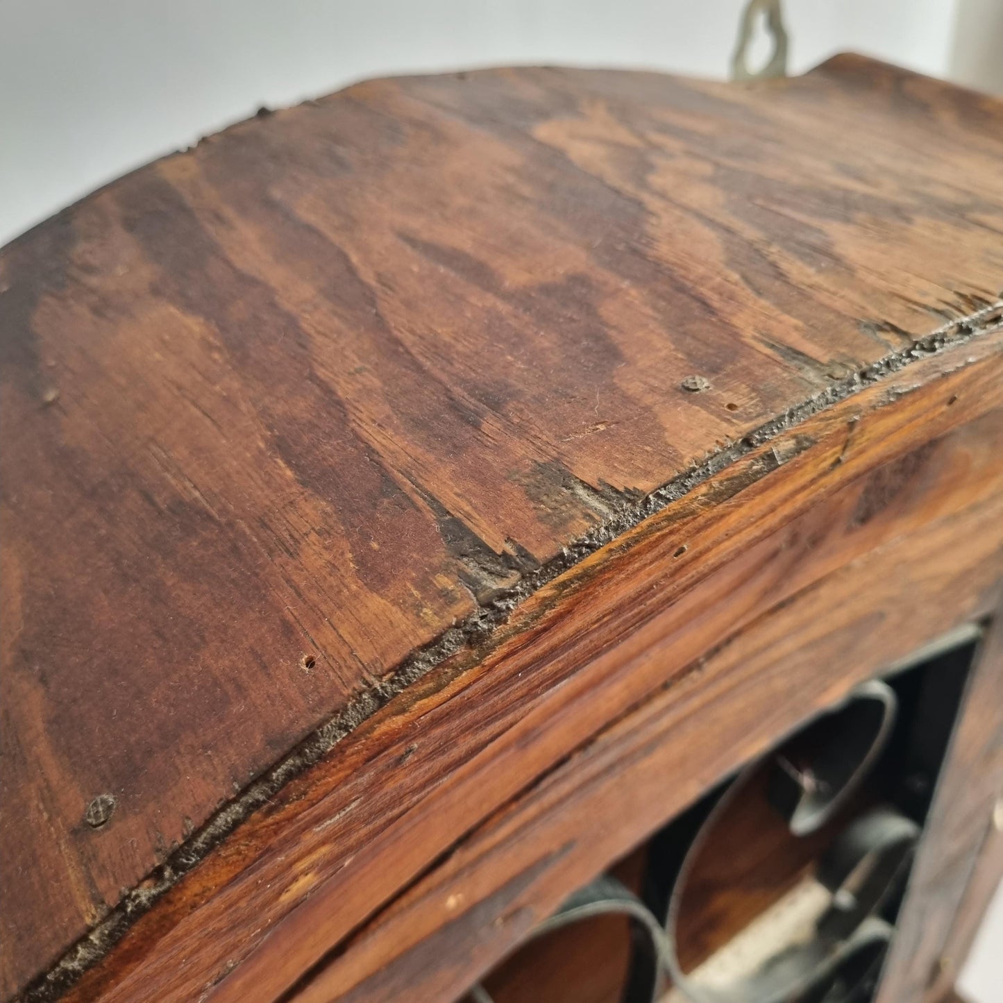 Close-up of weathered wood texture on Antique Rustic Wood Wall Cabinet with Iron Door: Farmhouse Kitchen Storage detail