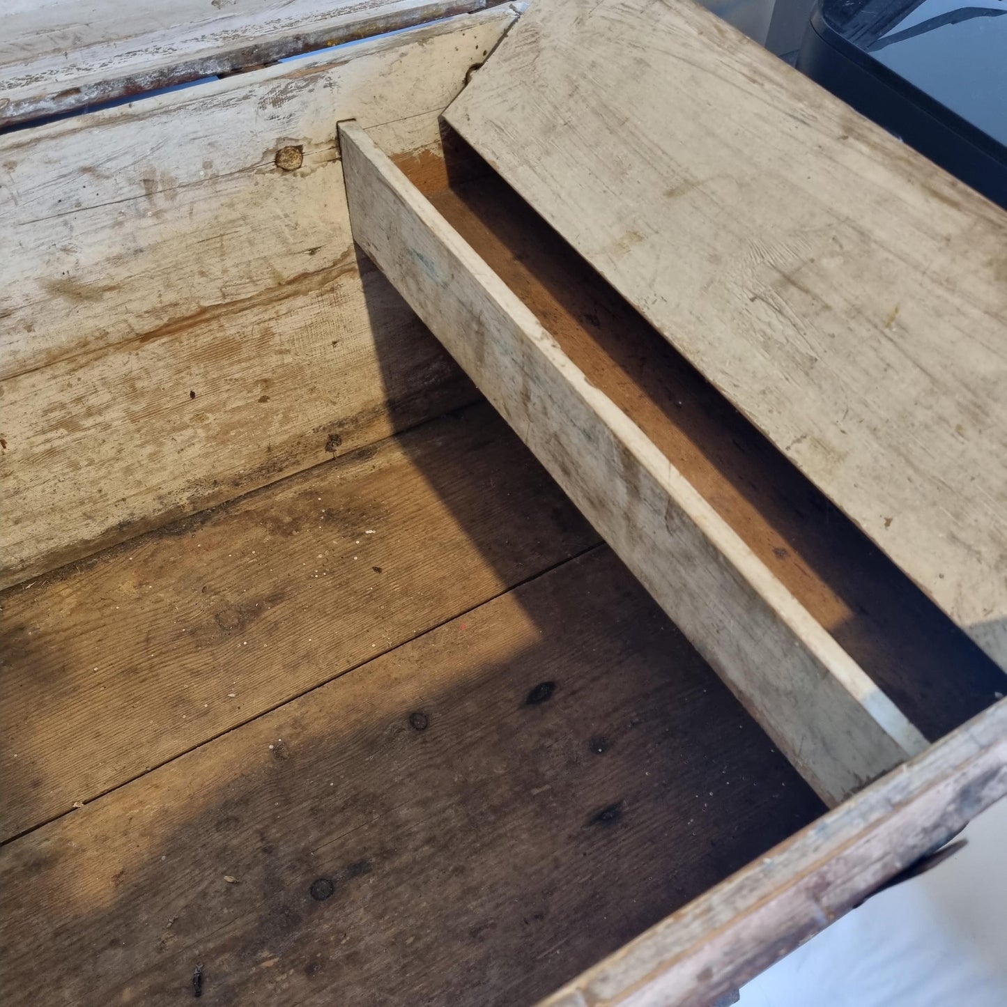 Interior view of Antique Swedish Kurbits Chest: 1854 Dalarna Folk Art Painted Trunk showing aged wooden storage compartment
