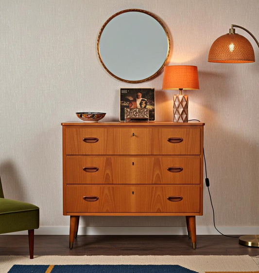 Mid-Century Modern Teak 3-Drawer Chest – Danish Design, 1960s with table lamp and round mirror in vintage interior