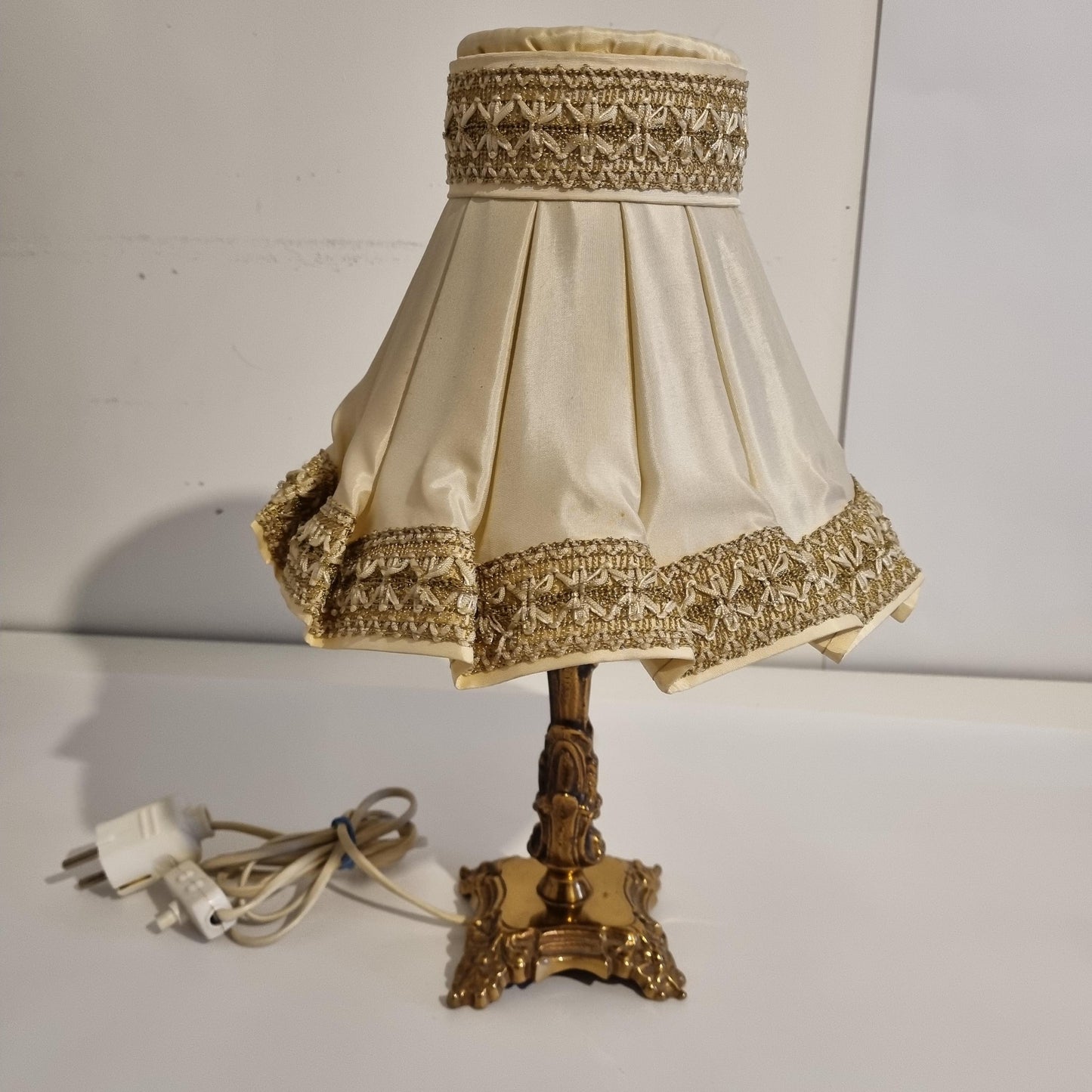 Vintage brass table lamp with pleated shade – ornate baroque style lighting, original piece, elegant cream and gold design.