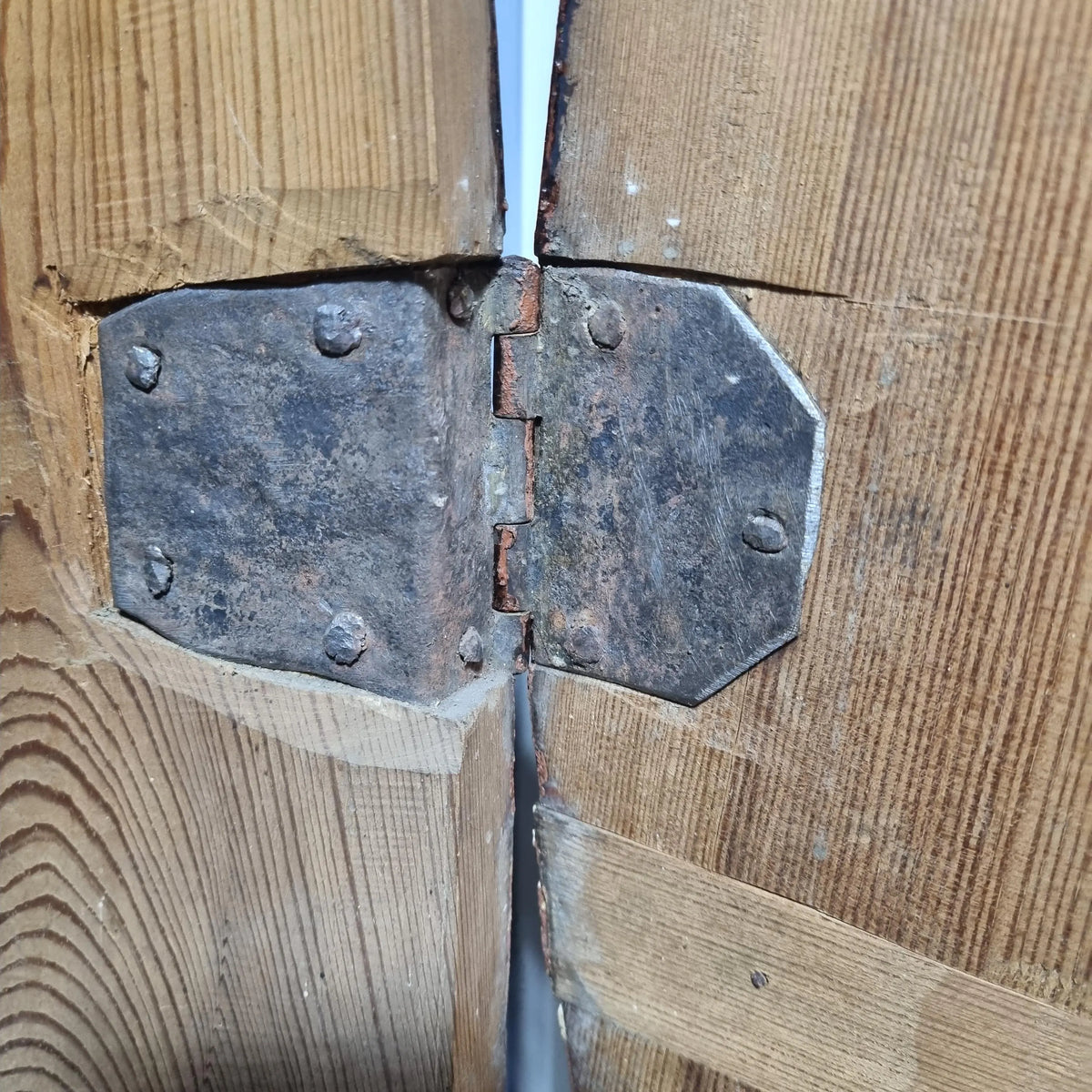 Close-up of original hand-forged hinge on antique Swedish Mora clock 1829